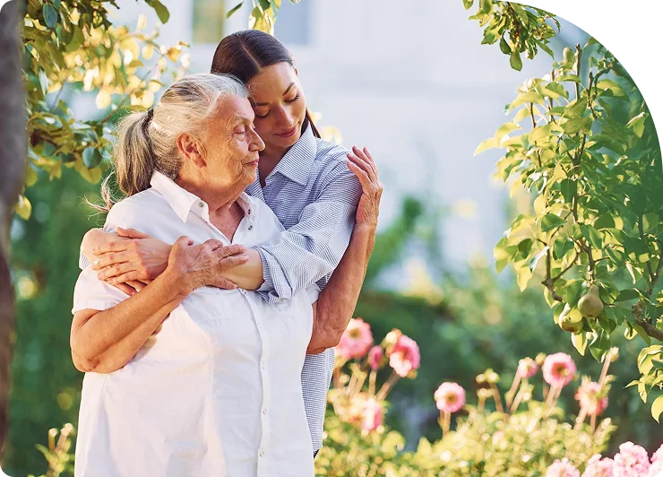 two happy women hugging