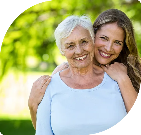 two happy women hugging
