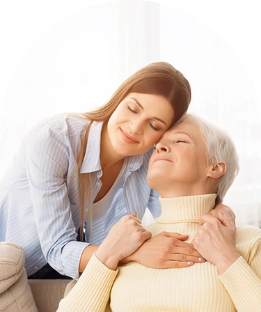 Mother and daughter embracing in a warm hug